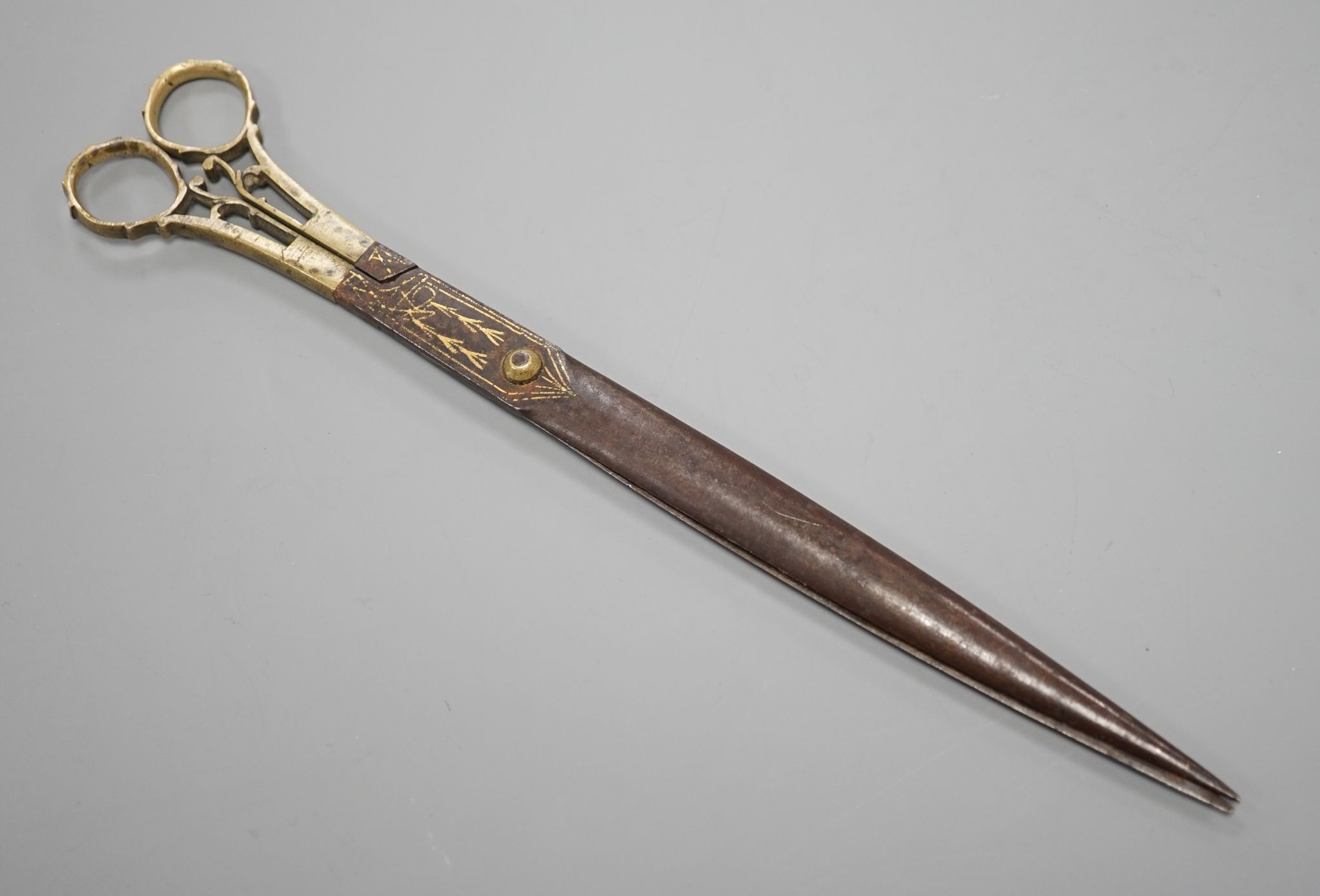 A pair of Ottoman gold damascened iron scissors, 23 cms long.